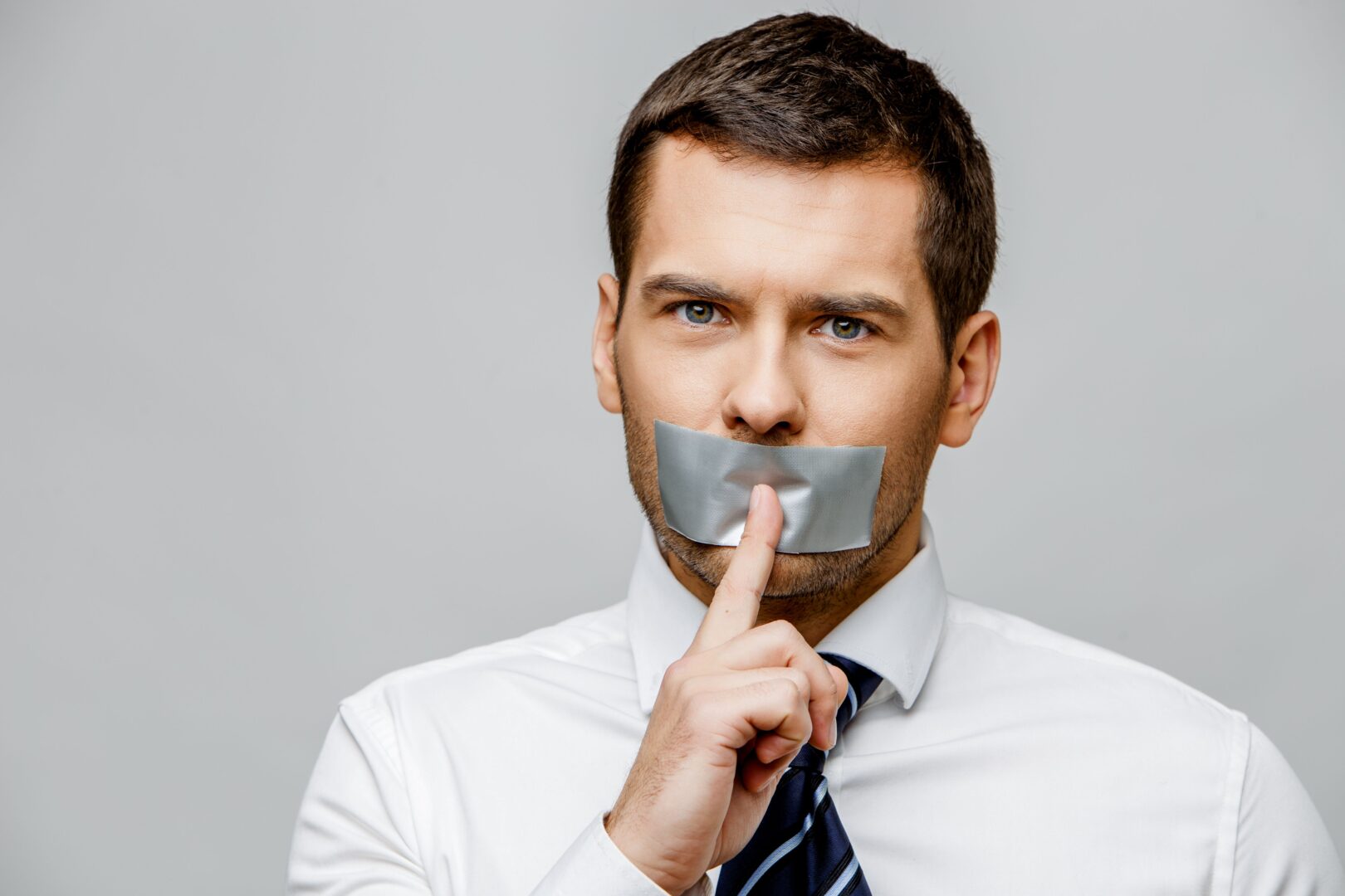What Your Broker Dosen't Want You To Know About Variable Annuities A man with duct tape over his mouth.