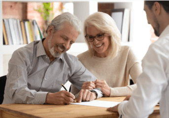 How To Choose The Right Medicare Advisor Baby Boomer Couple Signing Documents